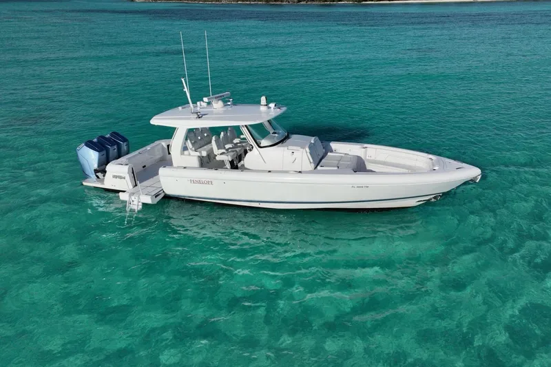 Slide: The Image of 2023 Intrepid 427 Nomad SE boat on open ocean under blue sky. - 13