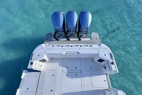 Slide: The Image of 2023 Intrepid 427 Nomad SE boat cruising on open ocean waters. - 21