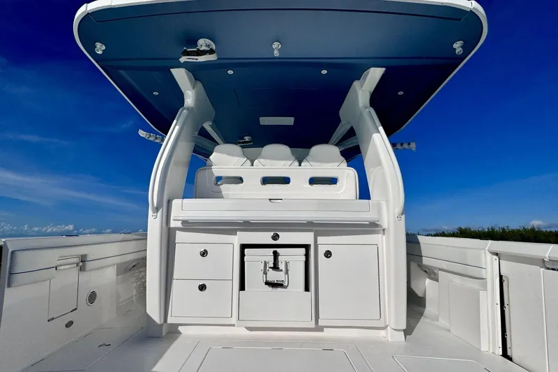 Slide: The Image of 2023 Intrepid 427 Nomad SE boat interior with open storage, ocean view. - 24