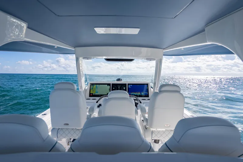 Slide: The Image of Interior view of 2023 Intrepid 427 Nomad SE boat with ocean backdrop. - 34