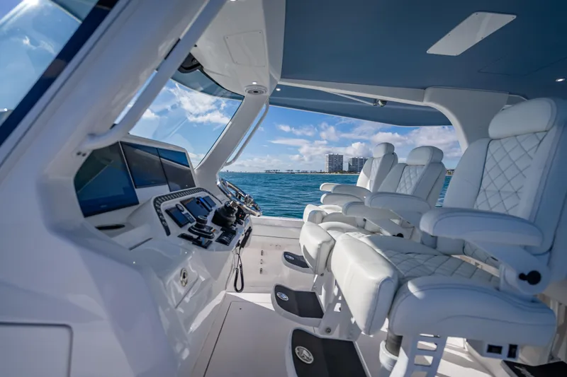 Slide: The Image of Luxurious interior of 2023 Intrepid 427 Nomad SE boat with plush seating and advanced controls. - 35