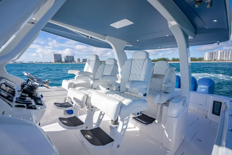 Slide: The Image of Luxurious interior of 2023 Intrepid 427 Nomad SE boat with plush seating and ocean view. - 36