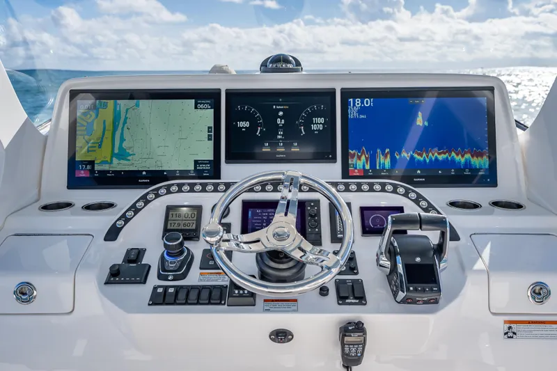 Slide: The Image of 2023 Intrepid 427 Nomad SE helm with advanced navigation displays and controls. - 37