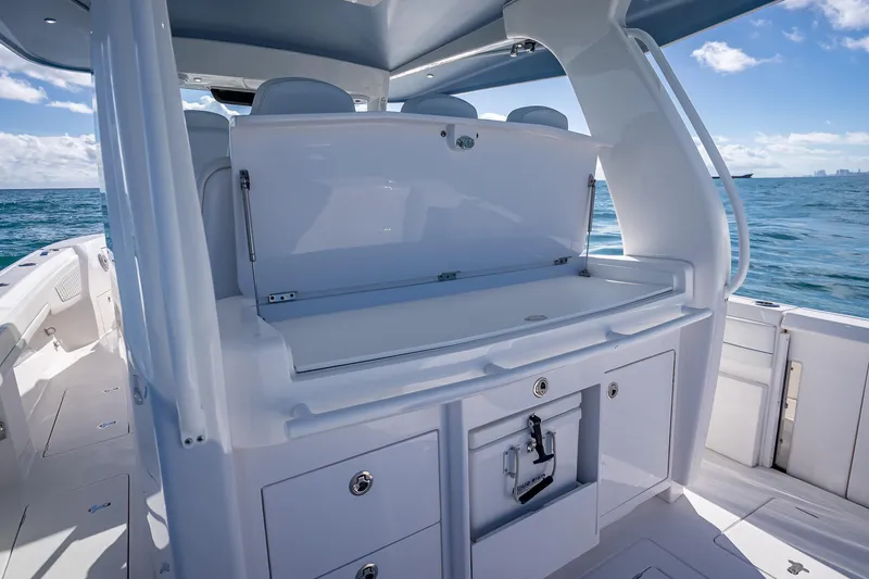 Slide: The Image of 2023 Intrepid 427 Nomad SE boat interior with sleek design and ocean view. - 39