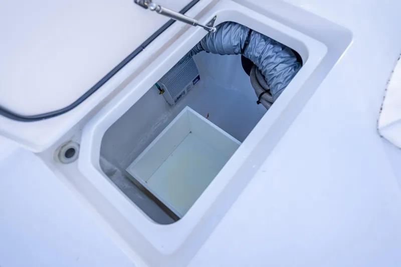 Slide: The Image of Open storage compartment on 2023 Intrepid 427 Nomad SE boat, showcasing interior details. - 40