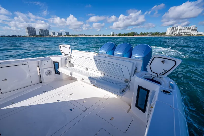 Slide: The Image of 2023 Intrepid 427 Nomad SE boat with triple engines on open water. - 41