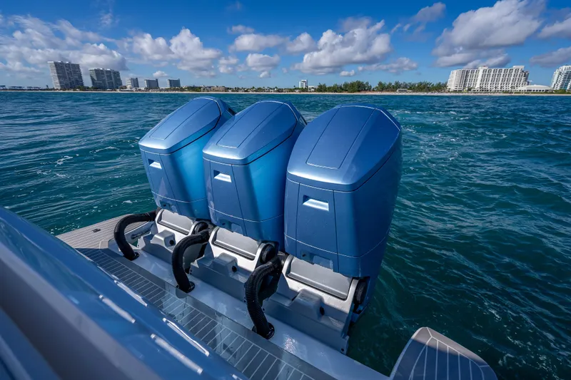 Slide: The Image of Triple outboard engines on 2023 Intrepid 427 Nomad SE, cruising in coastal waters. - 42