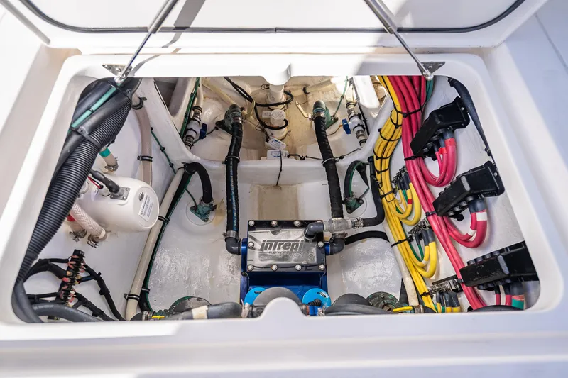 Slide: The Image of 2023 Intrepid 427 Nomad SE engine compartment with colorful wiring and components. - 53