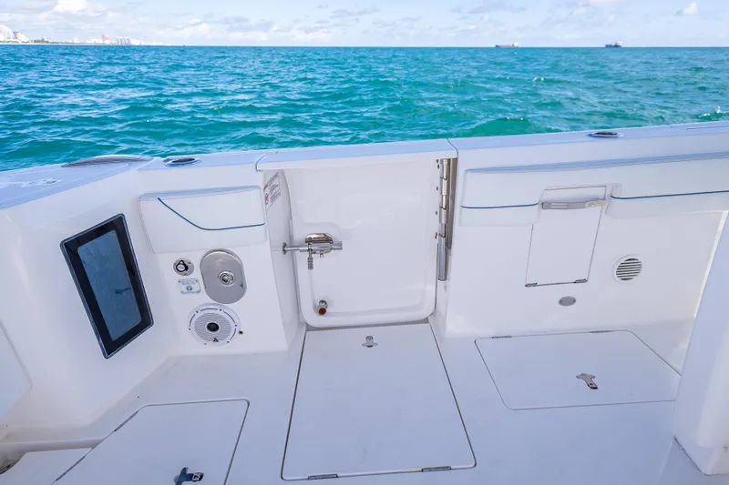 Slide: The Image of 2023 Intrepid 427 Nomad SE boat deck with ocean view, featuring sleek design and modern amenities. - 54