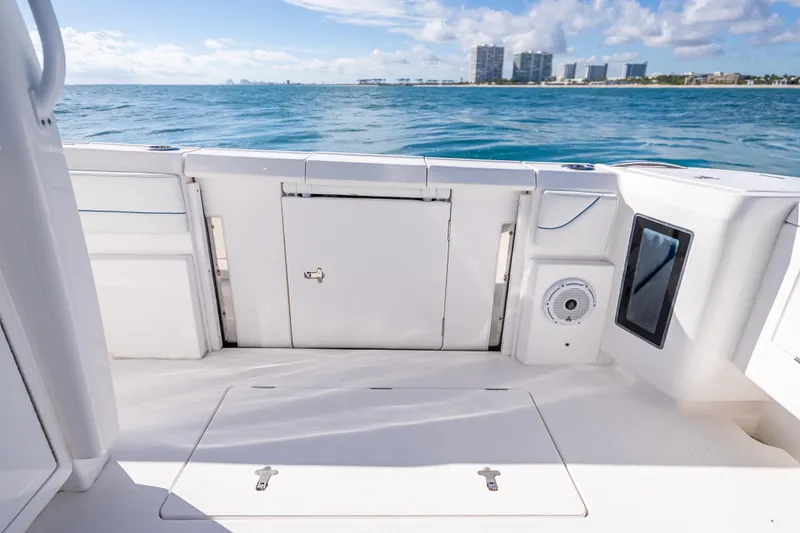 Slide: The Image of 2023 Intrepid 427 Nomad SE boat interior with ocean view and city skyline. - 55