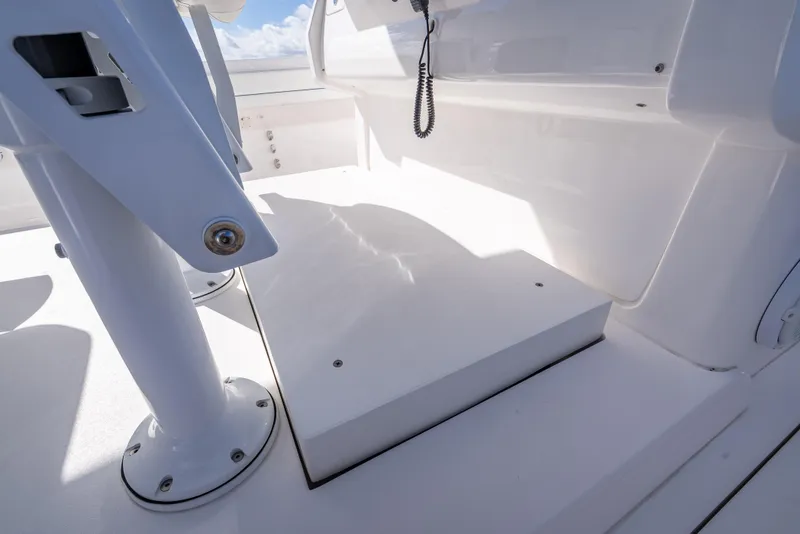 Slide: The Image of 2023 Intrepid 427 Nomad SE boat interior with white seating and fixtures. - 56