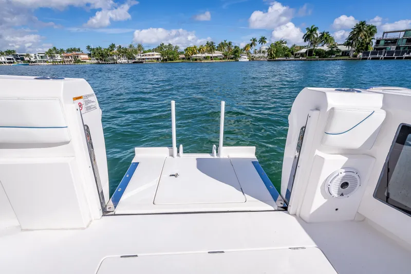 Slide: The Image of 2023 Intrepid 427 Nomad SE boat deck with scenic waterfront view. - 57