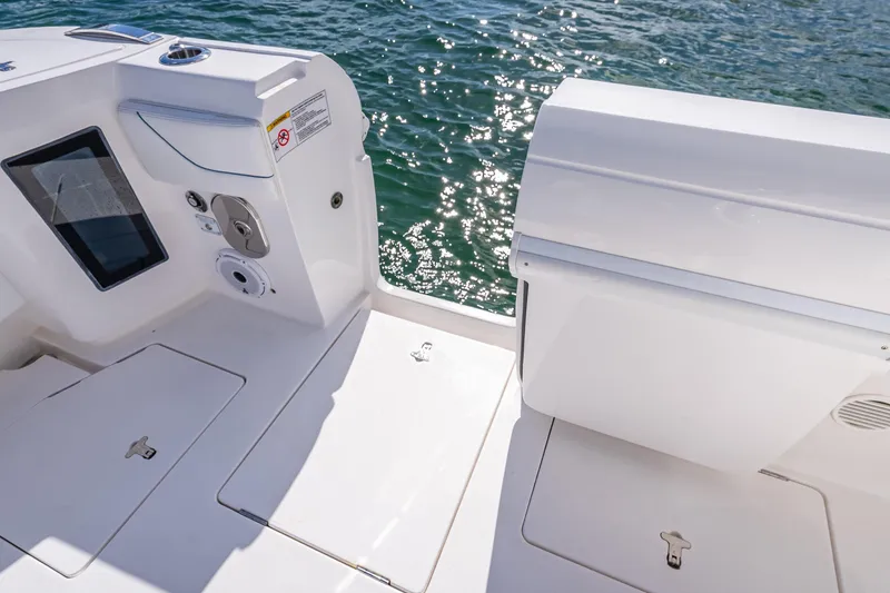 Slide: The Image of 2023 Intrepid 427 Nomad SE boat deck with water view, featuring sleek design elements. - 58