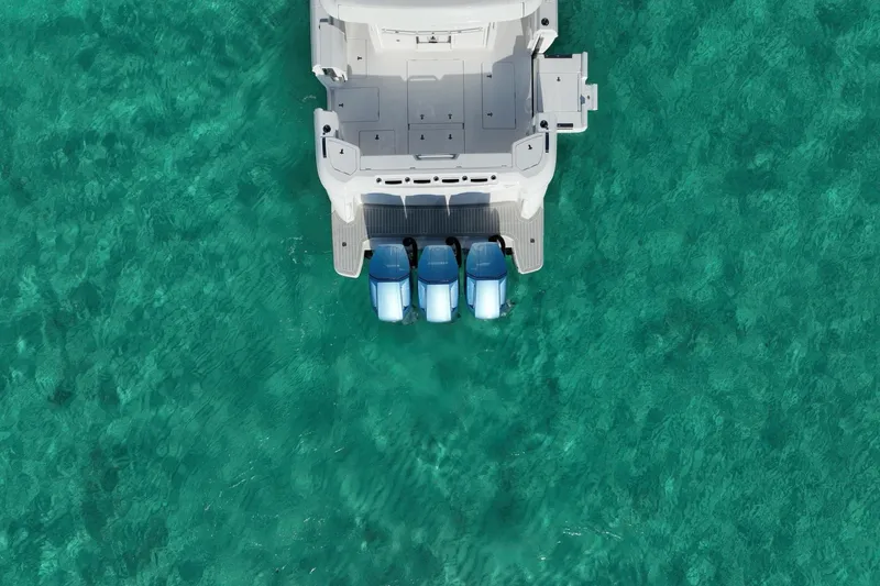 Slide: The Image of 2023 Intrepid 427 Nomad SE cruising on open ocean under blue sky. - 9