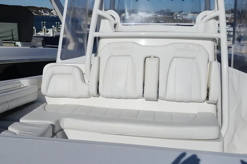 Slide: The Image of 2019 Regulator 34SS boat with white cushioned seating and sleek design. - 28