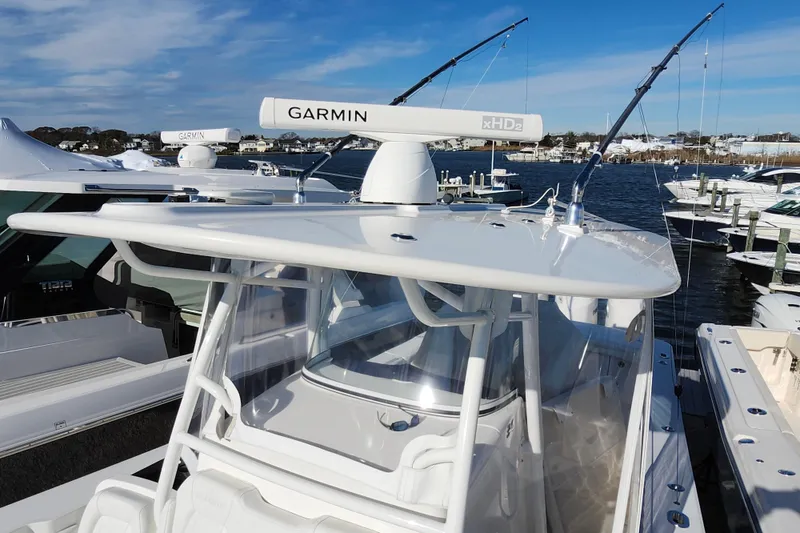 Slide: The Image of 2019 Regulator 34SS boat with Garmin radar, docked at marina. - 31