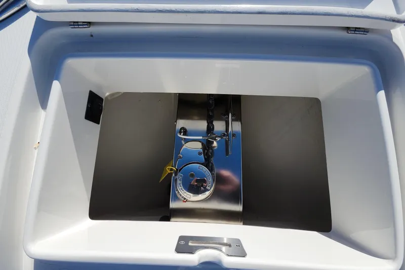 Slide: The Image of 2019 Regulator 34SS boat compartment with stainless steel fittings and secure latch. - 32