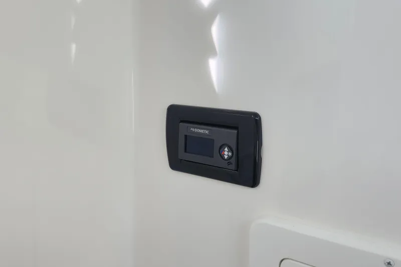 Slide: The Image of Control panel on 2019 Regulator 34SS boat interior wall. - 33