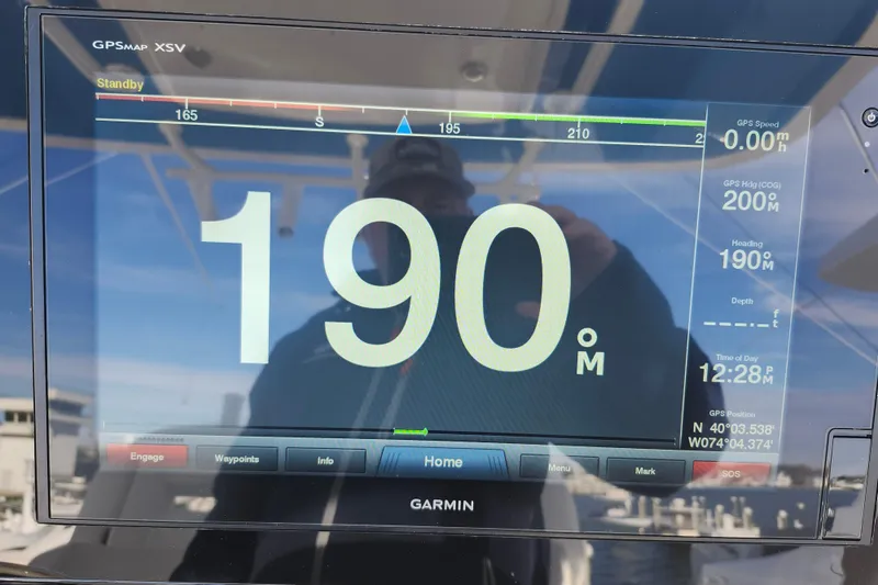 Slide: The Image of Garmin GPS display on 2019 Regulator 34SS boat showing heading and speed. - 34