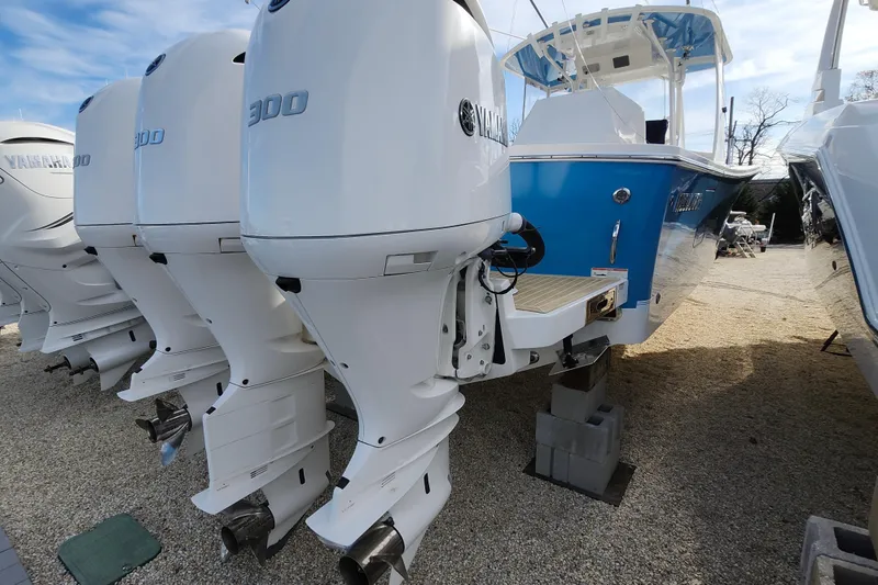 Slide: The Image of 2019 Regulator 34SS boat with Yamaha 300 engines, displayed on gravel. - 39