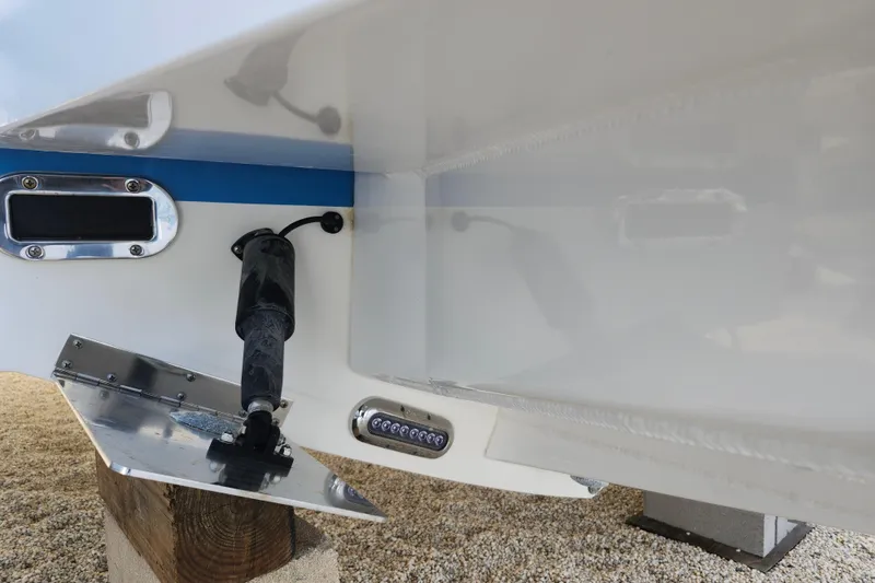 Slide: The Image of 2019 Regulator 34SS boat hull detail with trim tab and underwater light. - 40