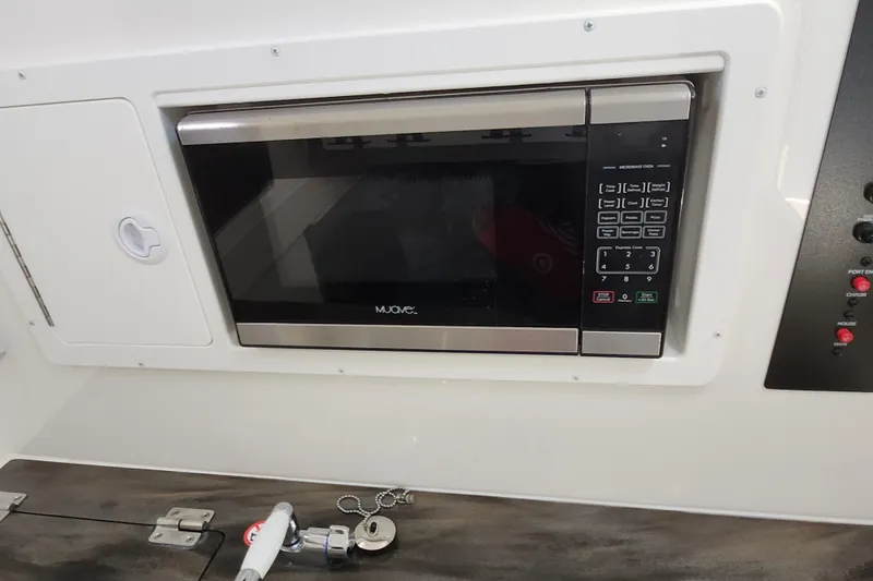 Slide: The Image of Built-in microwave in 2019 Regulator 34SS boat interior. - 45