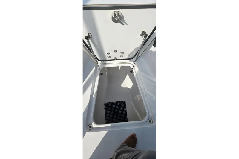 Slide: The Image of Livewell interior of 2018 Sportsman Heritage 251 Center Console boat. - 14