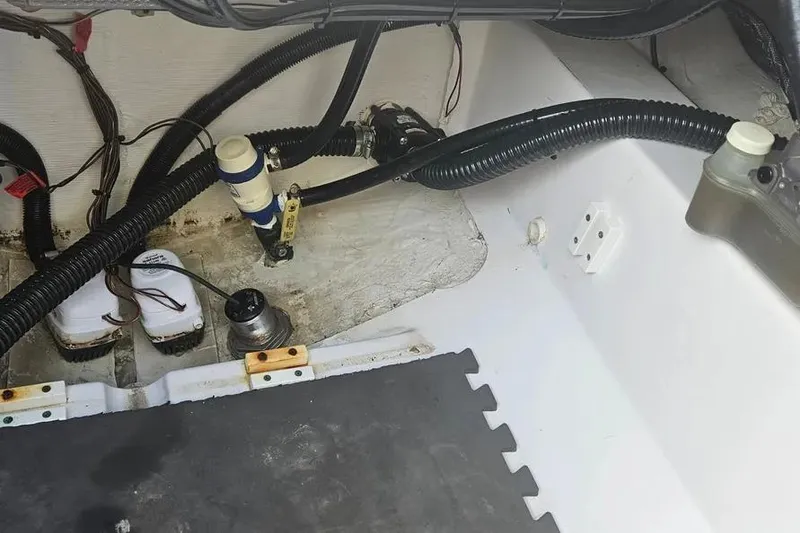 Slide: The Image of Open storage compartment on 2018 Sportsman Heritage 251 Center Console boat. - 15