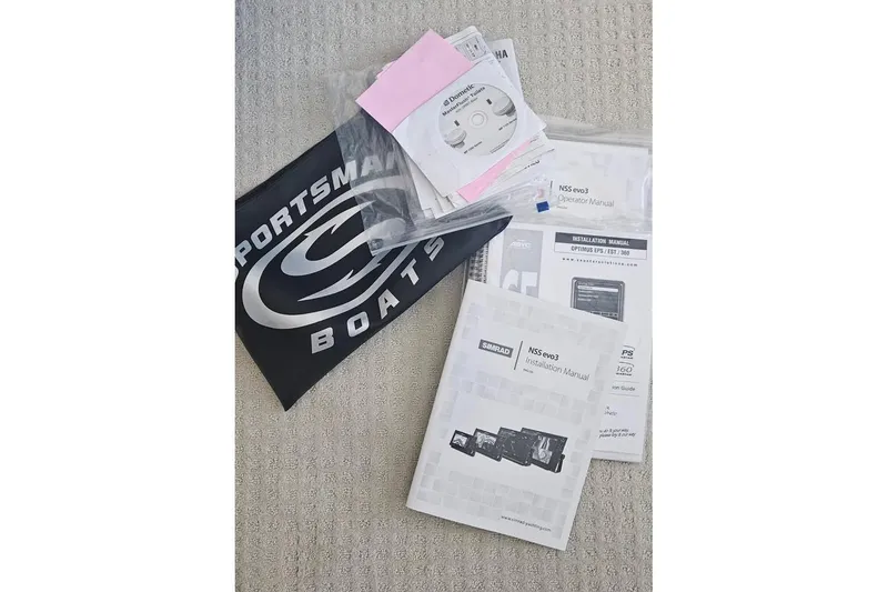 Slide: The Image of 2018 Sportsman Heritage 251 Center Console boat covered and stored outdoors. - 9