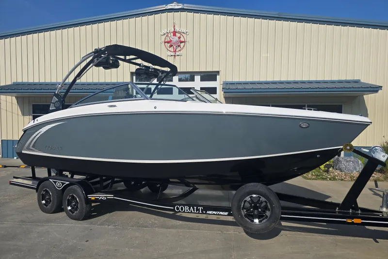 Slide: The Image of 2019 Cobalt R5 Surf boat on trailer outside a marine building. - 20