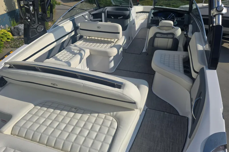 Slide: The Image of 2019 Cobalt R5 Surf boat interior with luxurious white seating and modern dashboard. - 22