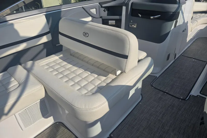 Slide: The Image of 2019 Cobalt R5 Surf boat interior with white cushioned seating and sleek design. - 26
