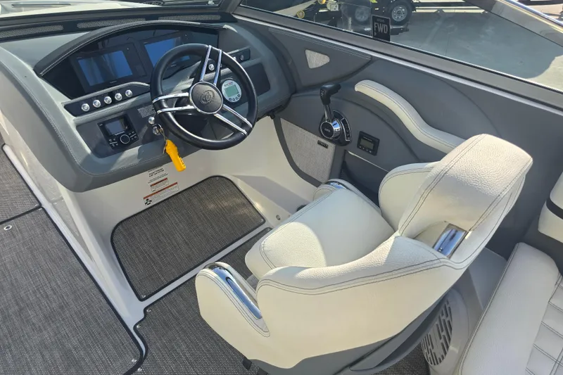 Slide: The Image of 2019 Cobalt R5 Surf boat cockpit with steering wheel and control panel. - 29