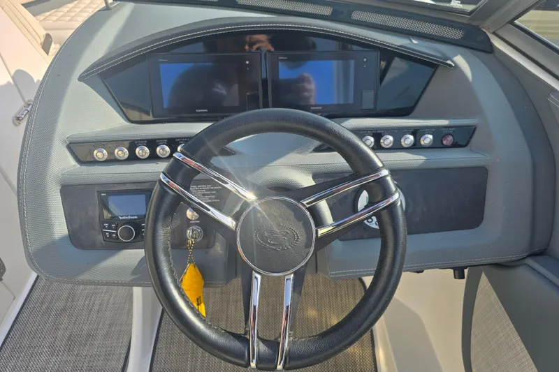 Slide: The Image of 2019 Cobalt R5 Surf boat dashboard with steering wheel and digital displays. - 30
