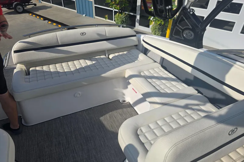 Slide: The Image of 2019 Cobalt R5 Surf boat interior with white cushioned seating and sleek design. - 37