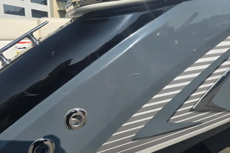 Slide: The Image of 2019 Cobalt R5 Surf boat close-up, showcasing sleek design and metallic finish. - 43