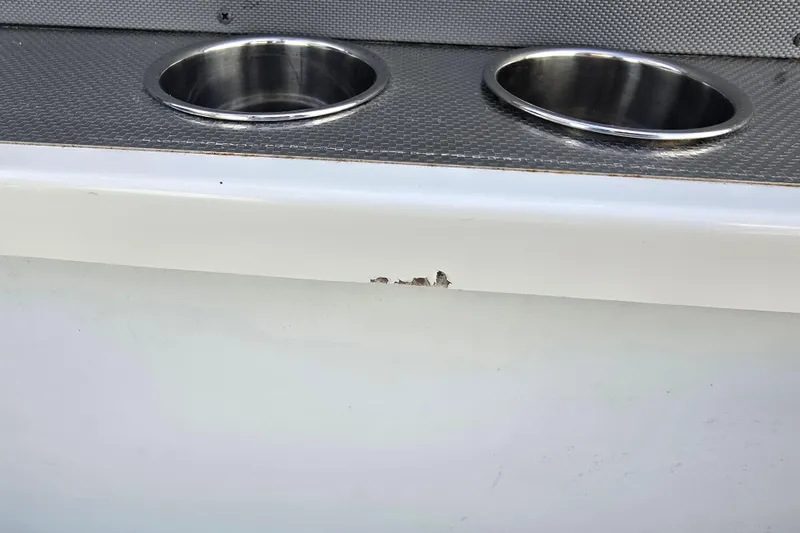 Slide: The Image of 2019 Cobalt R5 Surf boat with cup holders and minor hull damage. - 45