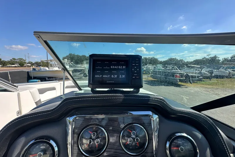 Slide: The Image of Dashboard of a 2015 Chaparral 246 boat with Garmin navigation system. - 14