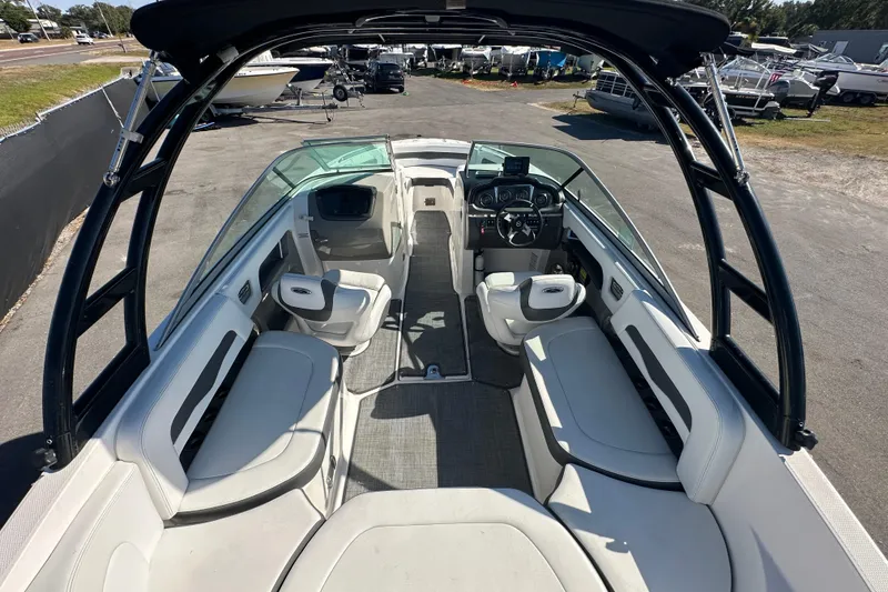 Slide: The Image of Dashboard gauges of a 2015 Chaparral 246 boat, featuring speedometer and fuel indicators. - 18