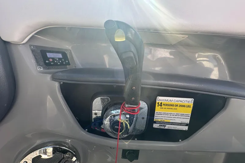 Slide: The Image of Control panel of a 2015 Chaparral 246 boat with capacity label. - 22