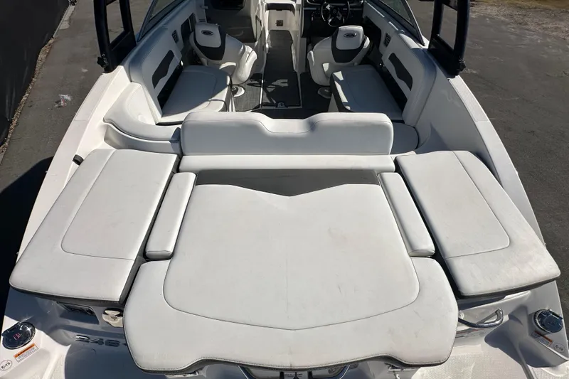 Slide: The Image of 2015 Chaparral 246 boat interior with spacious white seating and modern design. - 25