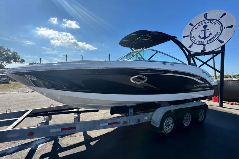 Slide: The Image of 2015 Chaparral 246 boat on trailer under clear blue sky. - 3