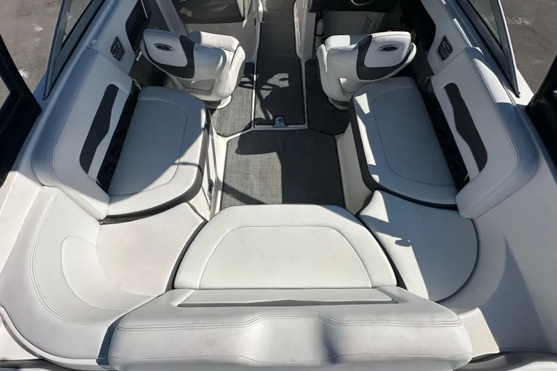 Slide: The Image of 2015 Chaparral 246 boat interior with spacious seating and modern design. - 32
