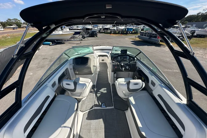 Slide: The Image of Interior view of 2015 Chaparral 246 boat with seating and steering console. - 33