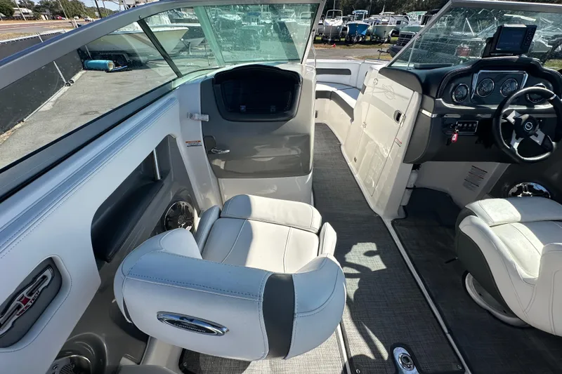 Slide: The Image of 2015 Chaparral 246 boat interior with modern dashboard and comfortable seating. - 36