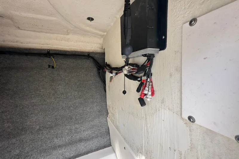 Slide: The Image of Electrical wiring and components inside a 2015 Chaparral 246 boat. - 48