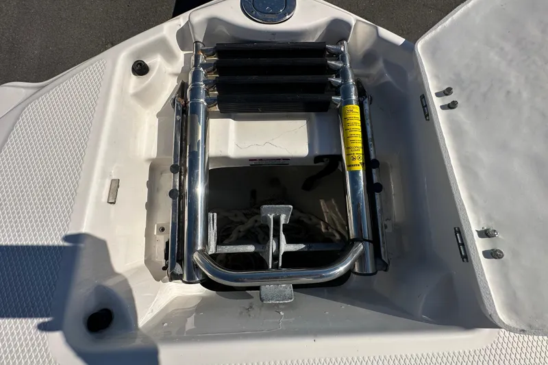 Slide: The Image of 2015 Chaparral 246 boat ladder and anchor storage compartment. - 60