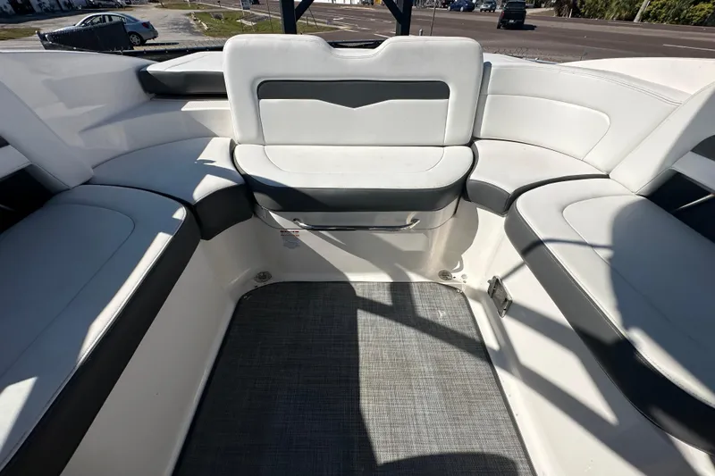 Slide: The Image of 2015 Chaparral 246 boat interior with white seating and gray accents. - 71