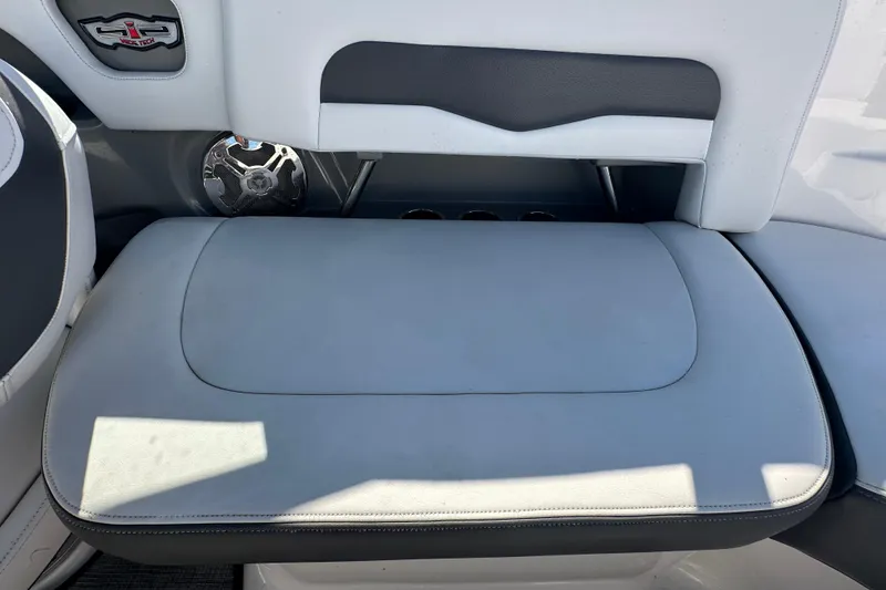 Slide: The Image of 2015 Chaparral 246 boat interior with cushioned seating and speaker detail. - 72