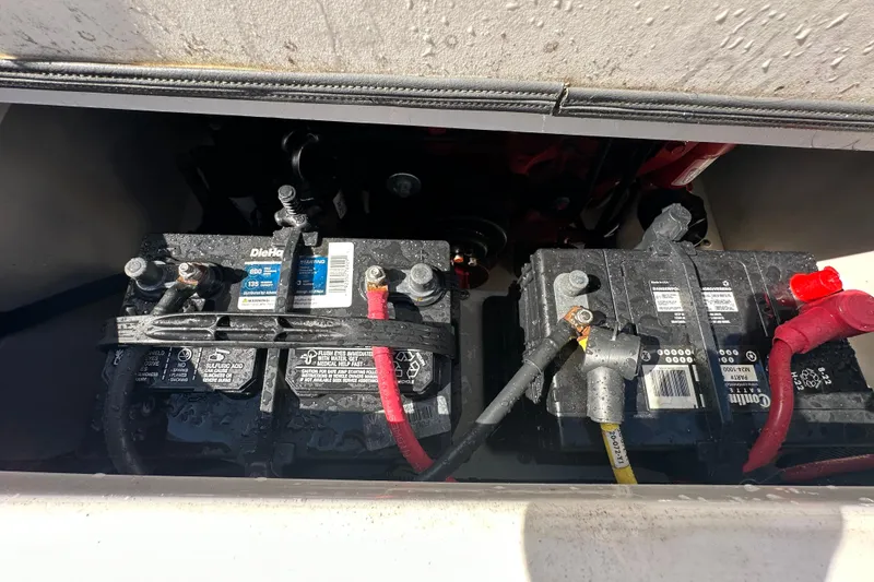 Slide: The Image of Batteries in a 2015 Chaparral 246 boat, showing wiring and connections. - 76